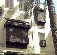 View of Cairo houses with masharabiyya (screen or grille of tined wood)