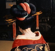 A geisha in traditional dress and make-up