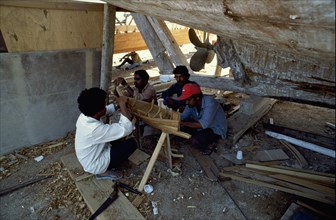 Shipwrights building a model dhow