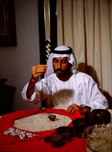 Jawad al-Moosawi, general manager of the al-Fardan jewellers, weighing pearls