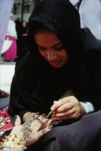 Geometric and floral decorative henna patterns were applied to adorn the hands and feet of young women on occasions such as weddings