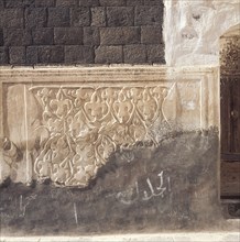 Incised plasterwork beside a doorway