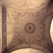 Plaster ceiling incised with geometric designs and freize of Arabic calligraphy