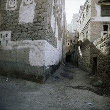 A narrow street in the town of Shibam