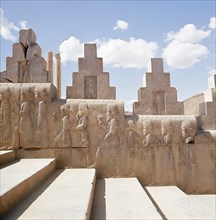 A detail of a relief carving on the staircase leading to the Tripylon at Persepolis, depicting the procession of Medes and Persians