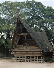The elaborate decoration of the gable ends on this Toba Batak house indicate that it belongs to the village head