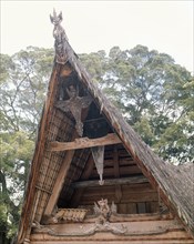 The elaborate decoration of the gable ends on this Toba Batak house indicate that it belongs to the village head