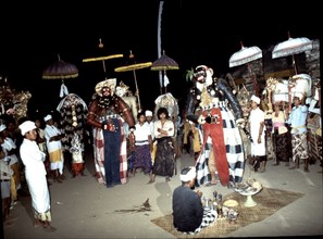 Before and after each masquerade the masks are brought to the temple where they are sprinkled with holy water by a priest