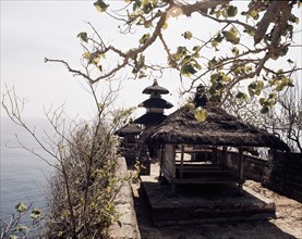 Tanah Lot, a small temple on a rocky outcrop cut off at high tide, is one of the most spectacular and popularof the island's thousands of temples