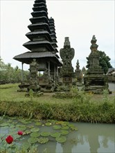 The water around the pagoda roofed shrines at the Pura Taman Ayun recalls the primeval ocean from which the cosmic mountain, symbolized by the shrines, formed the levels of the cosmos