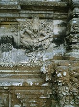 Detail showing the fusion of three dimensional and relief sculpture characteristic of Balinese stone carving