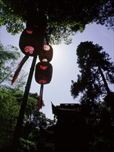 Hanging lanterns and the gate to the temple of Chuan Long Tiong (Yellow Dragon Cave)