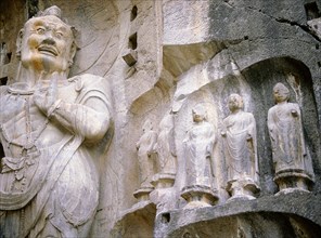 One of The Guardian kings of Buddhism, carved on the north wall of the Fengxian temple at the Longmen cave-temple complex