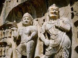 The Guardian kings of Buddhism carved on the north wall of the Fengxian temple at the Longmen cave-temple complex