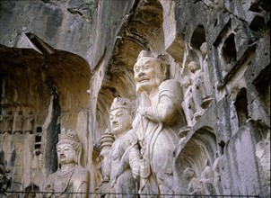 The Guardian kings of Buddhism carved on the north wall of the Fengxian temple at the Longmen cave-temple complex