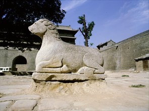 A statue of a kneeling horse near Xian city wall