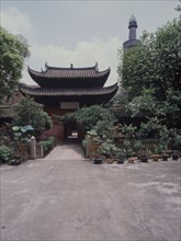 The courtyard and minaret of the Memorial Mosque to the Prophet, the Huai Sheng Si, more usually known as Beacon Tower Mosque, where the Islamic minaret rises above the roofline of traditional Chinese...