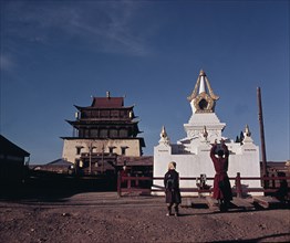 Mongolians praying at an open air shrine in the centre of Ulan Bator