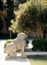 A stone lion at the pool of the Partal, Alhambra, Granada