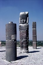 Close up of one Atlantid figure flanked by two carved columns, on top of the Quetzalcoatl pyramid in Tula