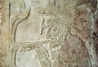 Detail of a bas relief sculpture showing the smoking God L, associated with commerce and the underworld