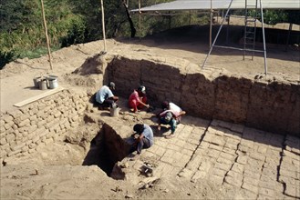 Archaeologists at work on the excavation of the temple-tomb pyramid at Sipan, Lambayeque Valley