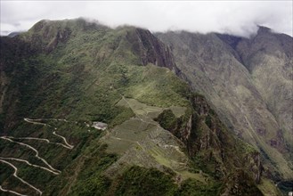 View of Machu Picchu and the modern access road from the summit of Huayna Picchu
