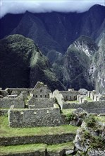 View of Machu Picchu buildings and Cloud Forest beyond