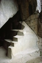 The "Royal Tomb" beneath the Temple of the Sun at Machu Picchu shows a mixture of living rock, Inca walling and Inca stone carving