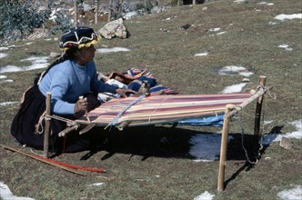 Quechua 'Inca' woman weaving on a horizontal single-heddle loom