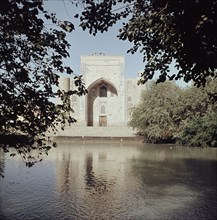 Madrasa in Bukhara, viewed across a lake