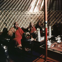 High ranking lamas during tea ceremony, in their yurt attached to the temple