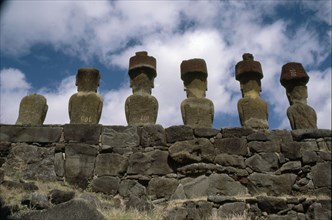 of 6 "Moai" figures re-erected on a platform (ahu) and "top knots" at Anakena Bay