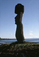 Silhouette of Moai statue with topknot, from the coast