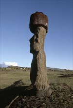 Silhouette profile of a "Moai" statue with "top knot" on the coast