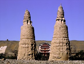 Dagodas near the site of the Mogao Caves, also known as the Thousand Buddha (Quinfodong) Caves, Dunhuang