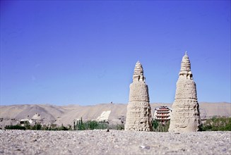Dagodas near the site of the Mogao Caves, also known as the Thousand Buddha (Quinfodong) Caves, Dunhuang