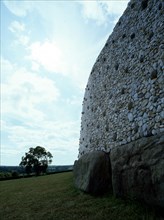 View of the stone walls that surround the heart-shaper mound covering the prehistoric passage tomb at Newgrange