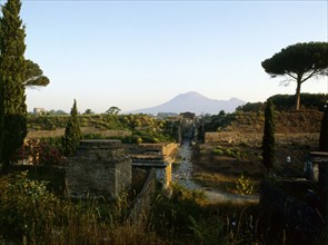 Tombs beyond the walls of Pompeii, with Vesuvius in the background