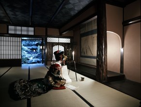 Geisha reading in the Shimabara district of Kyoto, one of Japan's earliest pleasure quarters which opened in the time of Hideyoshi Toyotomi