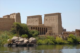 Panoramic view showing the First Pylon of the Temple of Isis with depictions of the goddess and the god horus in bas-relief