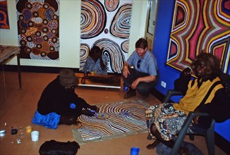 Balgo Community artist, the late Mati Mudgedell, working on a dot painting at the Warlayirti Culture Centre in the north-west desert region of Western Australia south of Halls Creek