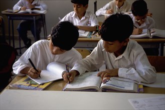 Ten year old boys in a classroom, Abu Dhabi
