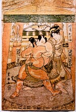 A detail of a woodblock print depicting sumo wrestlers