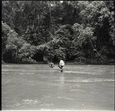 Boys crossing river