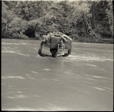 Boys crossing river