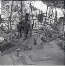 Ibo blacksmith and boy (Kenkwa country)