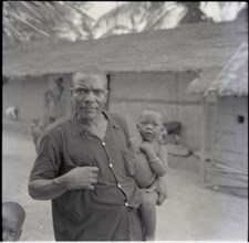 Tanyi Tiku and children in compound