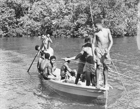 Boys in a canoe, Fiji