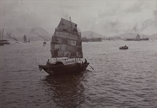 Sampan with a patchwork sail